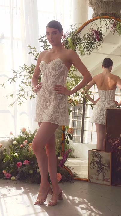 Video of a Woman wearing the Nalah White Short Corset Dress with Appliqués available at Boudoir 1861