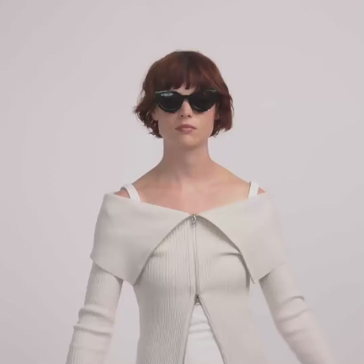 video of a woman wearing Alondra Black cat-eye sunglasses from Pilgrim available at la petite garçonne