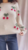 Video Person wearing Omaha Beige Sweater with Knitted Cherries from La petite garçonne 