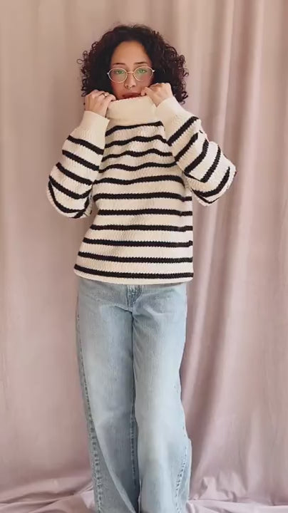 video person wearing Arcot Striped Knit Turtleneck Sweater from La petite garçonne