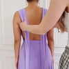 Tutorial video on model showing how to style our infinity dress with one shoulder twisted strap. 