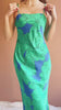 Video woman wearing Morgany Long Green Floral Dress from Boutique 1861 