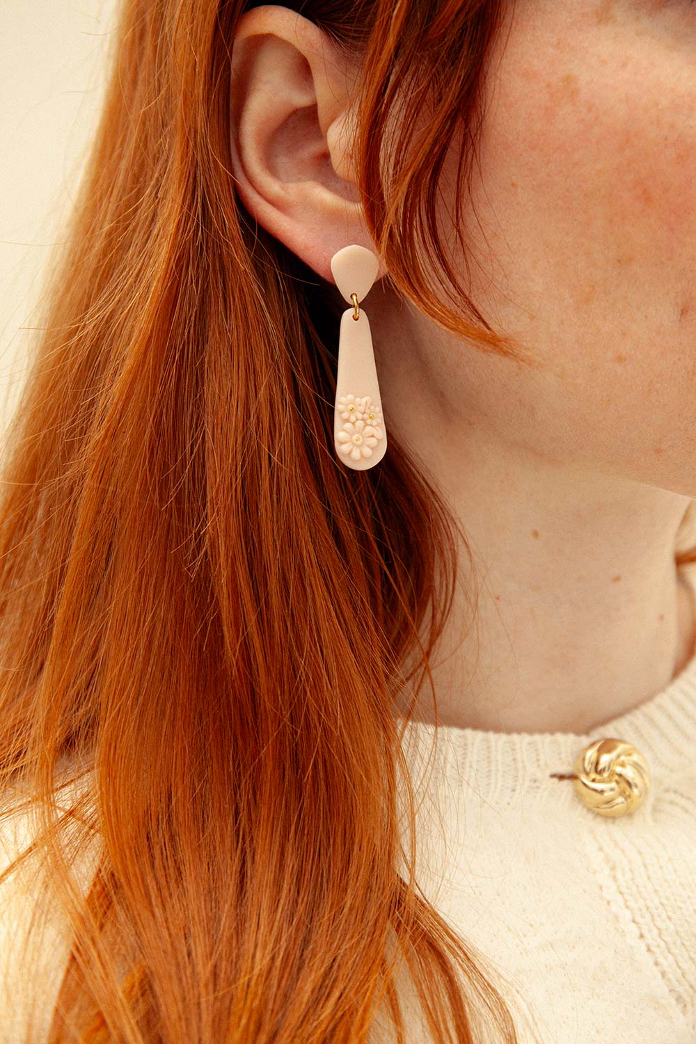woman wearing Pumdi Blush Pendant Earrings with Flowers from La petite garçonne