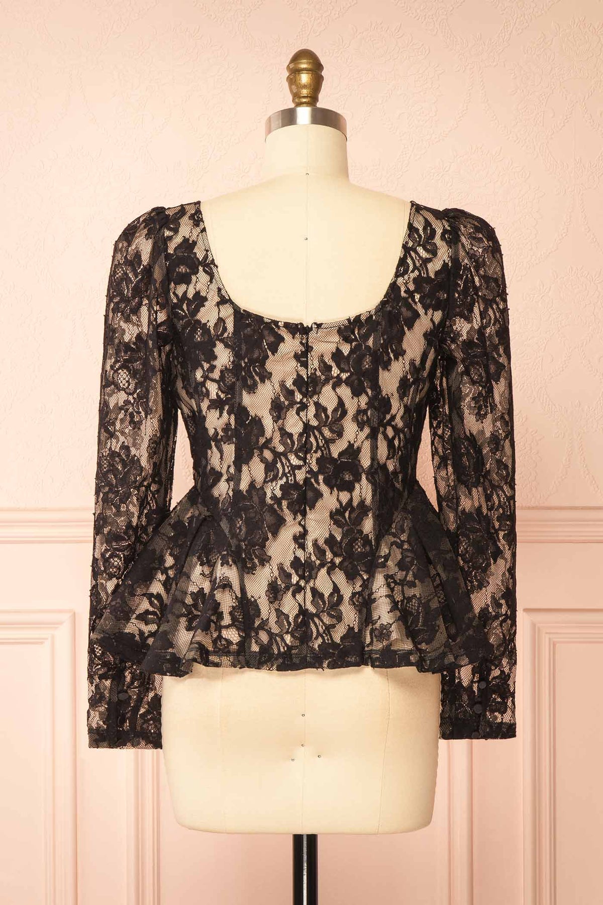 back view of Rabellia Black Floral Lace Peplum Top at Boutique 1861 