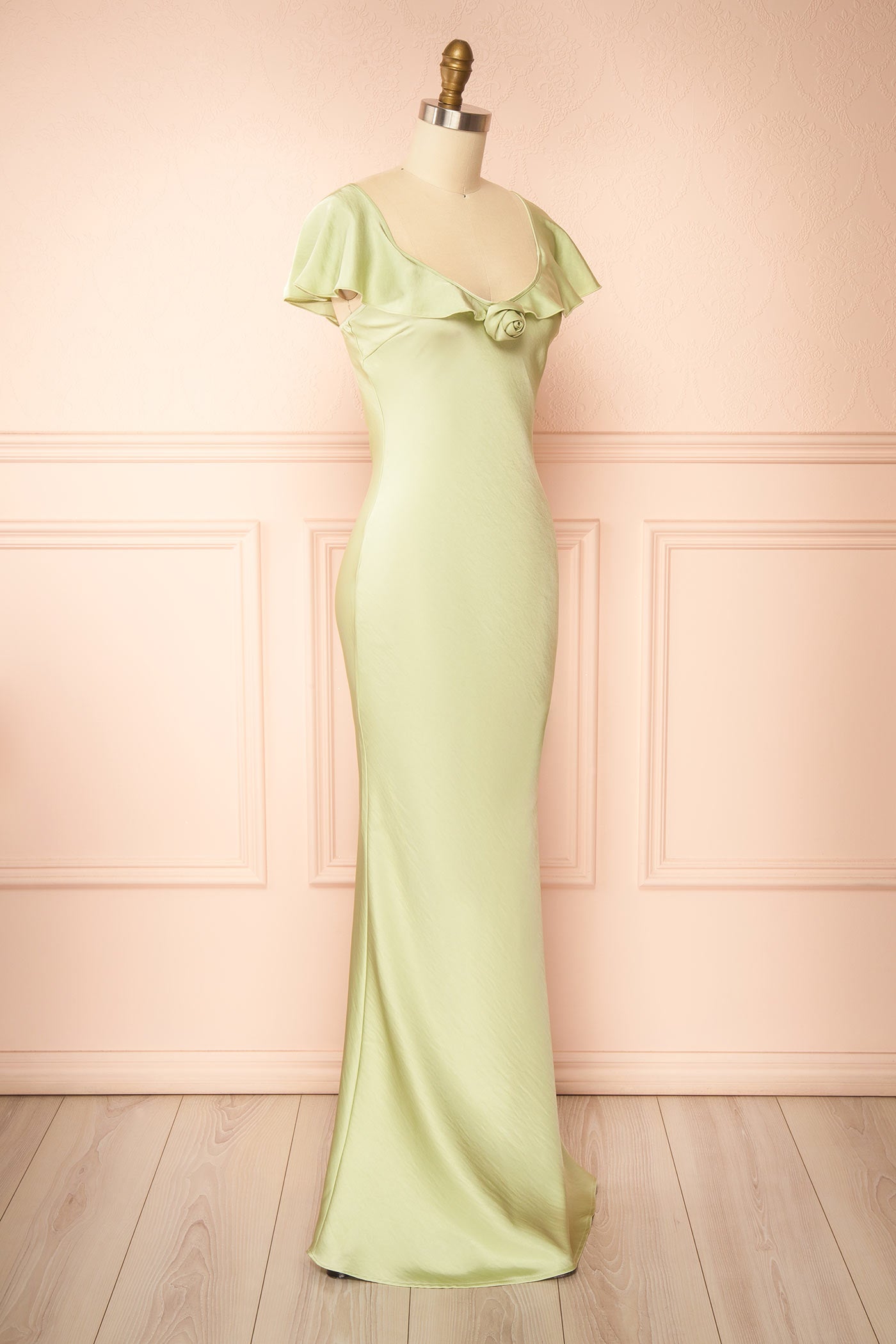 Profile view Rhiar Sage Satin Maxi Dress with Butterfly Sleeves and Flower Detail at la boutique 1861