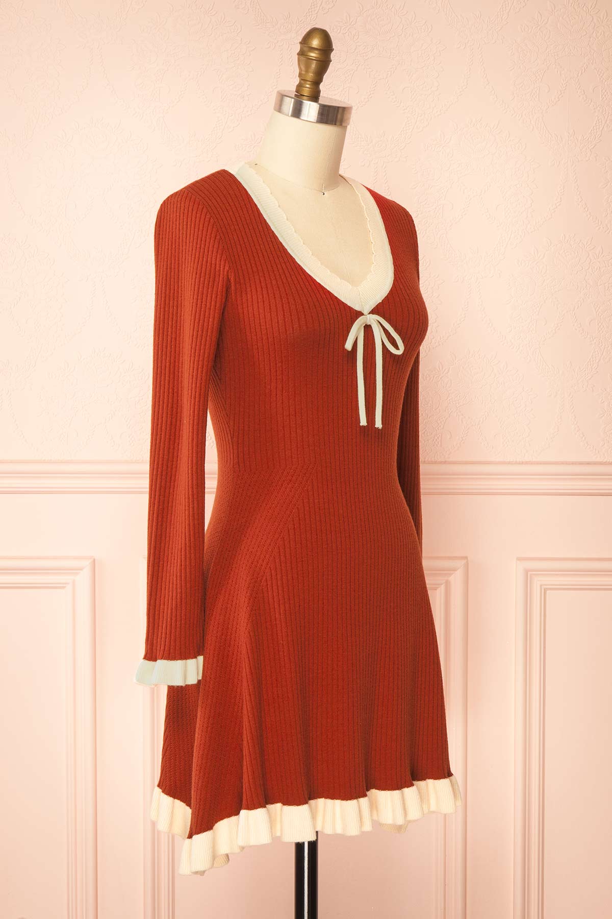side view of Sabrinne Red Ribbed Knit Long Sleeve Mini Dress with Contrast Ruffle Trim at Boutique 1861