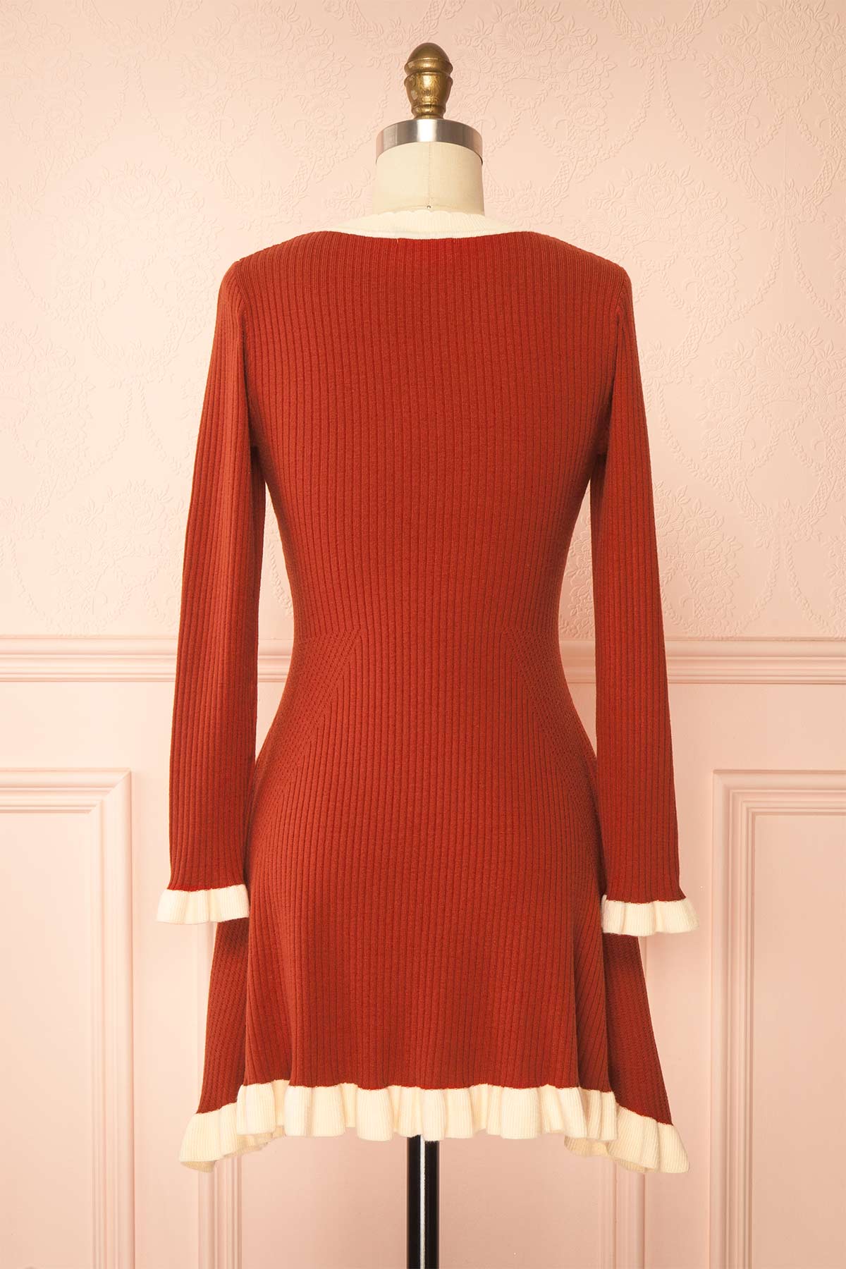 back view of Sabrinne Red Ribbed Knit Long Sleeve Mini Dress with Contrast Ruffle Trim at Boutique 1861