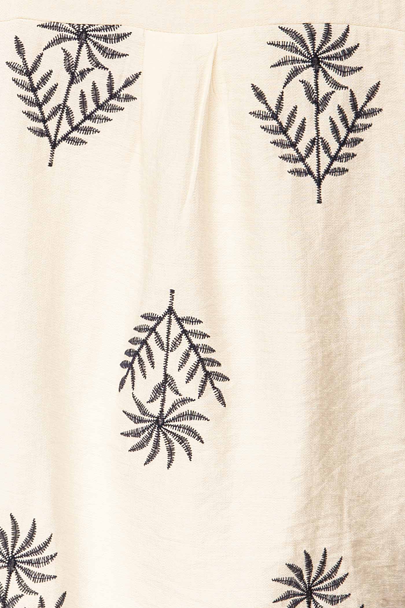 Close-up Sangrur Ivory Shirt with Knotted Hem and Botanical Print at la petite garçonne