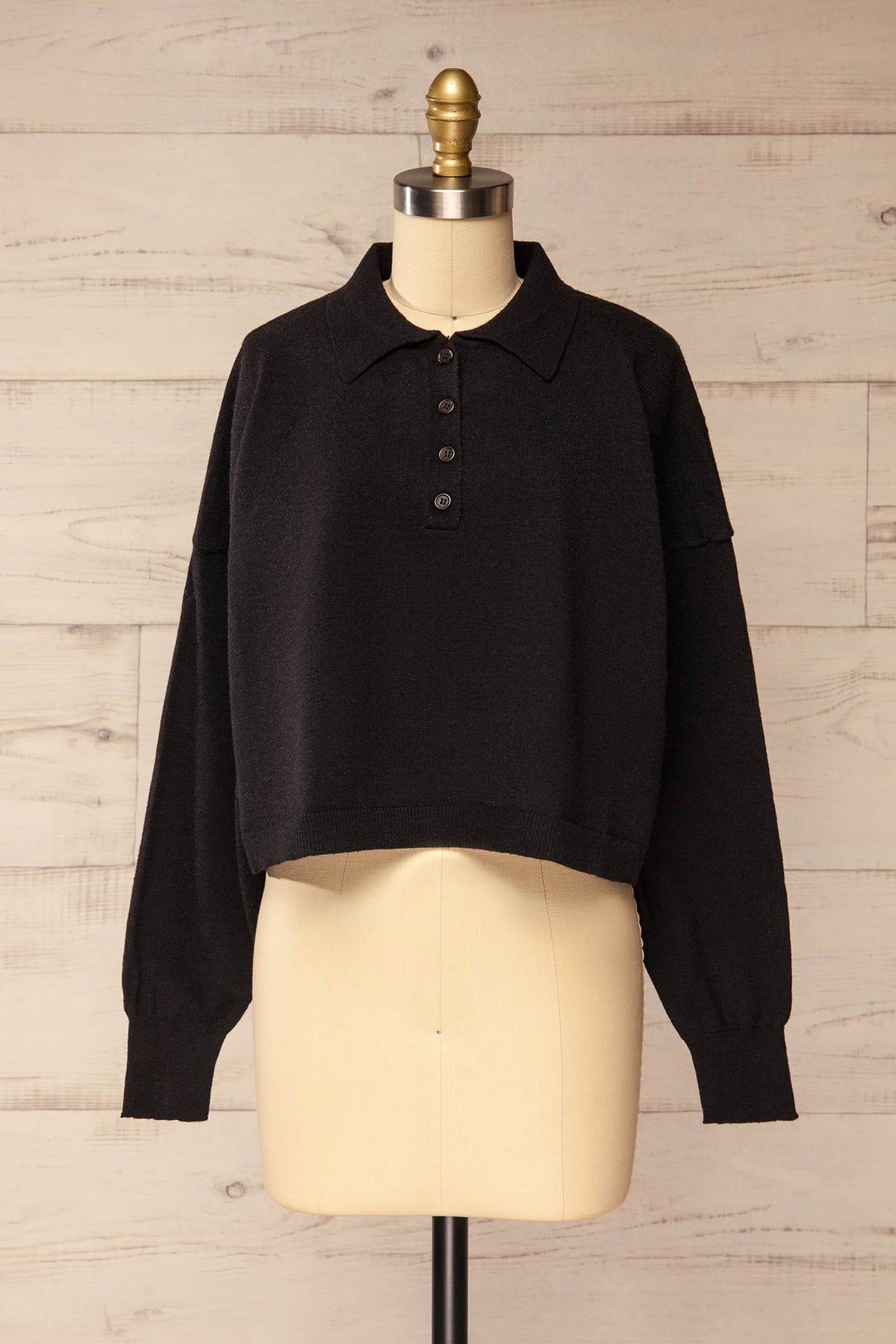 front view of Shigawake Black Cropped Polo Sweater at La petite garçonne