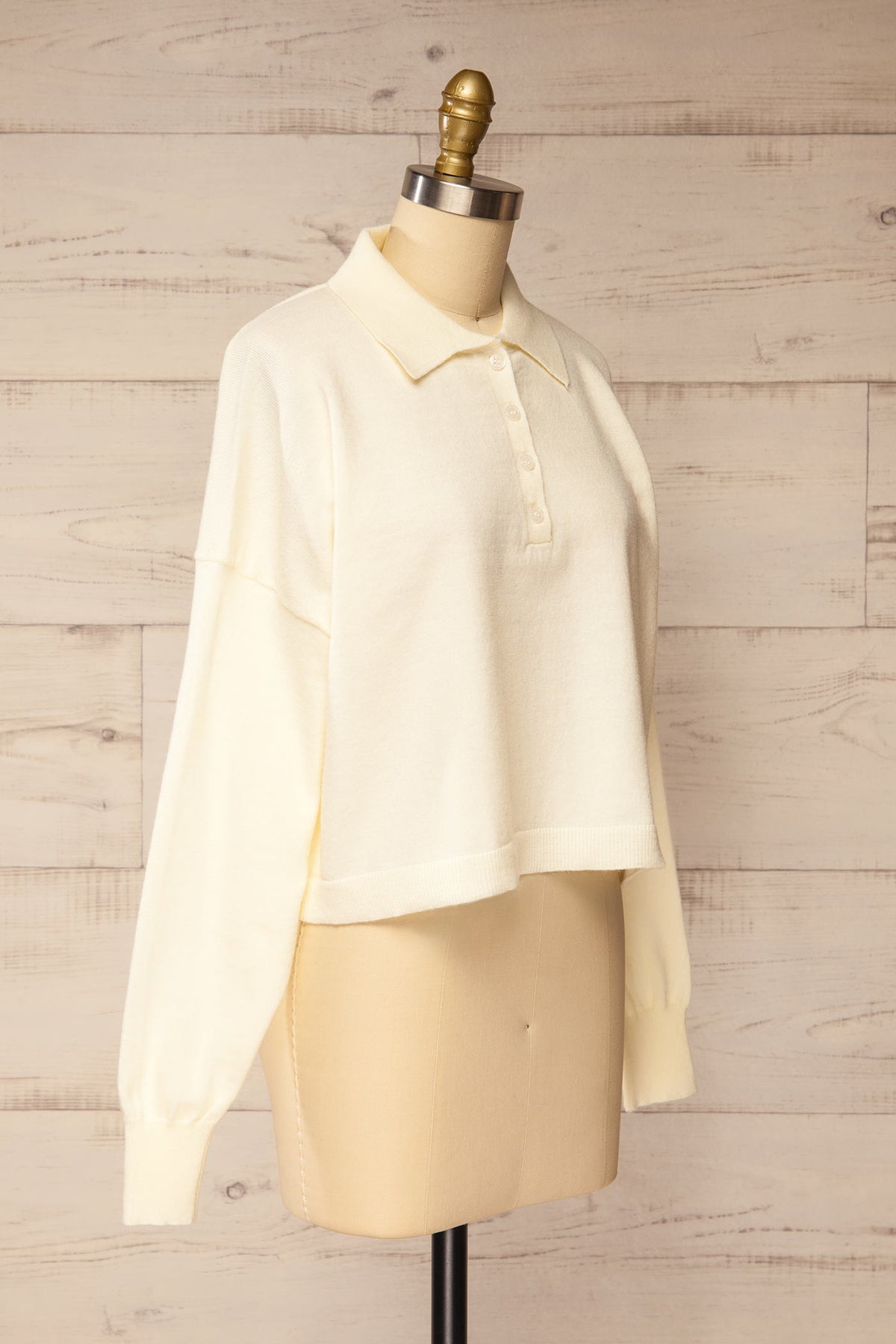 side view of Shigawake Ivory Cropped Polo Sweater at La petite garçonne