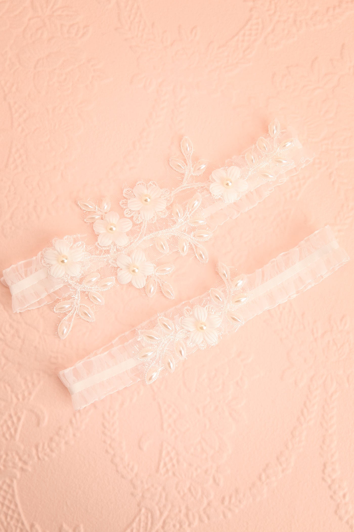 Top view Starling Bridal Garter Set with White Floral Lace and Pearls at boudoir 1861