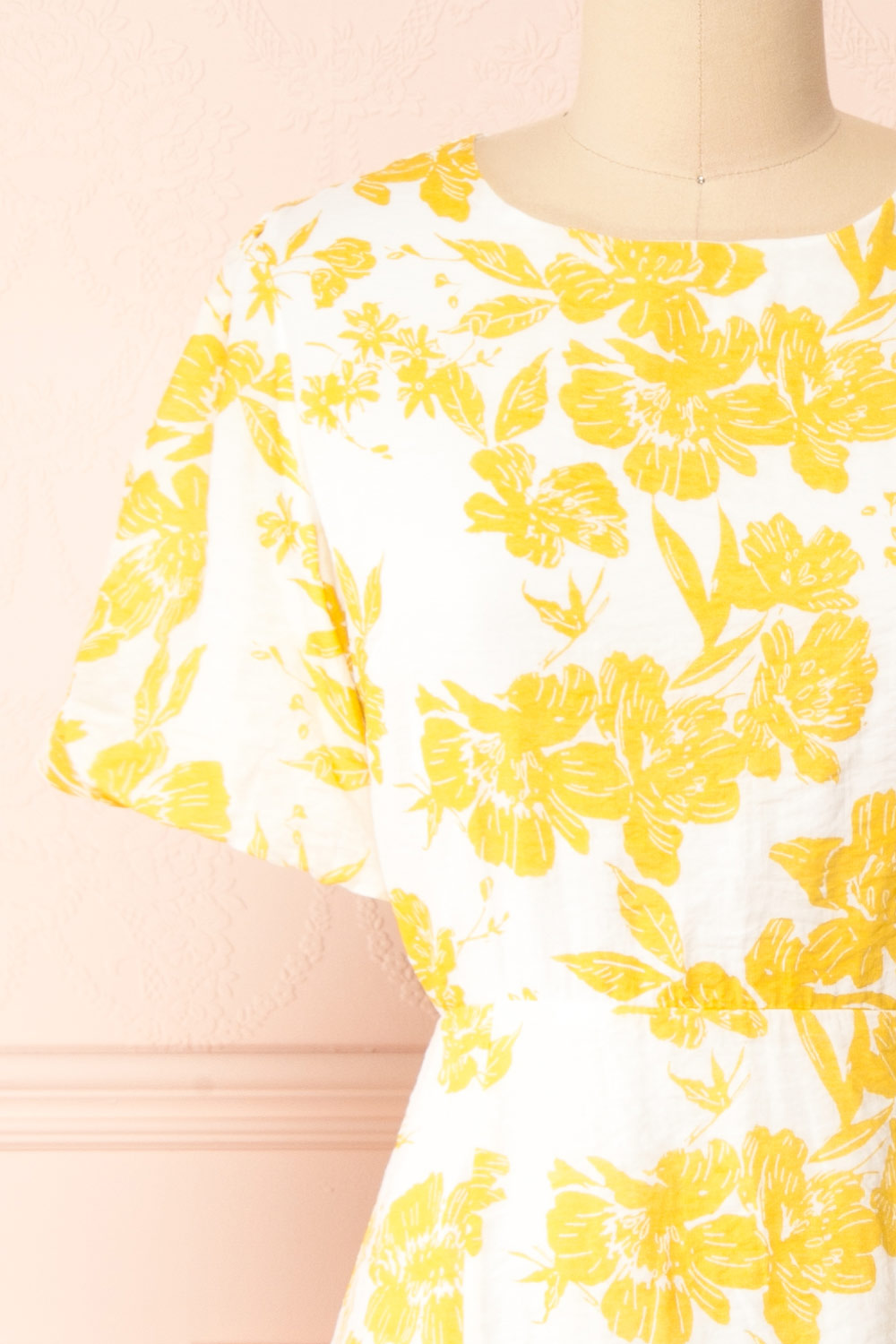 Swan Short Yellow Floral Dress w/ Open Back | Boutique 1861 front close-up