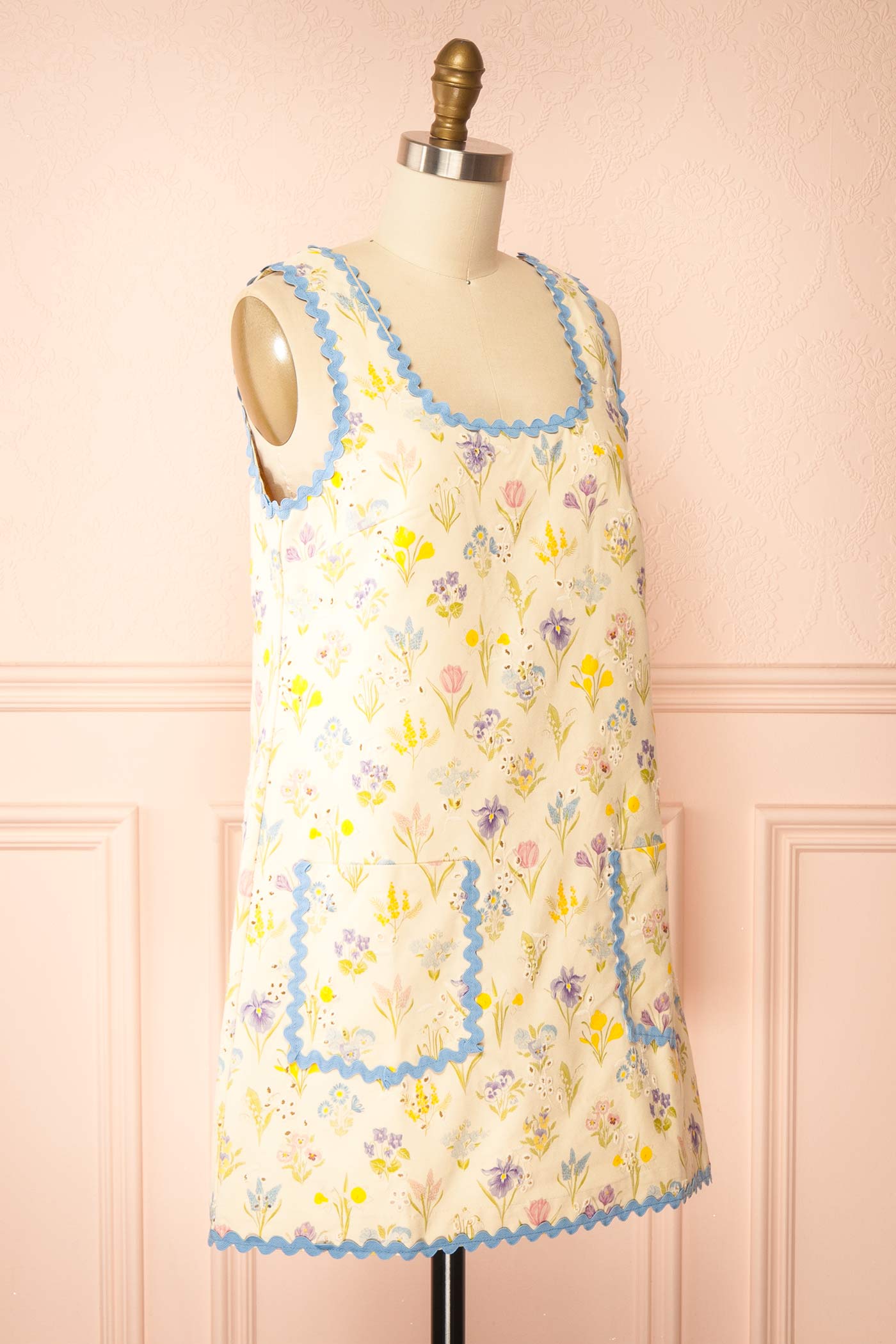 Profile view of Thessalia Beige Floral Short Dress with Pockets at boutique 1861