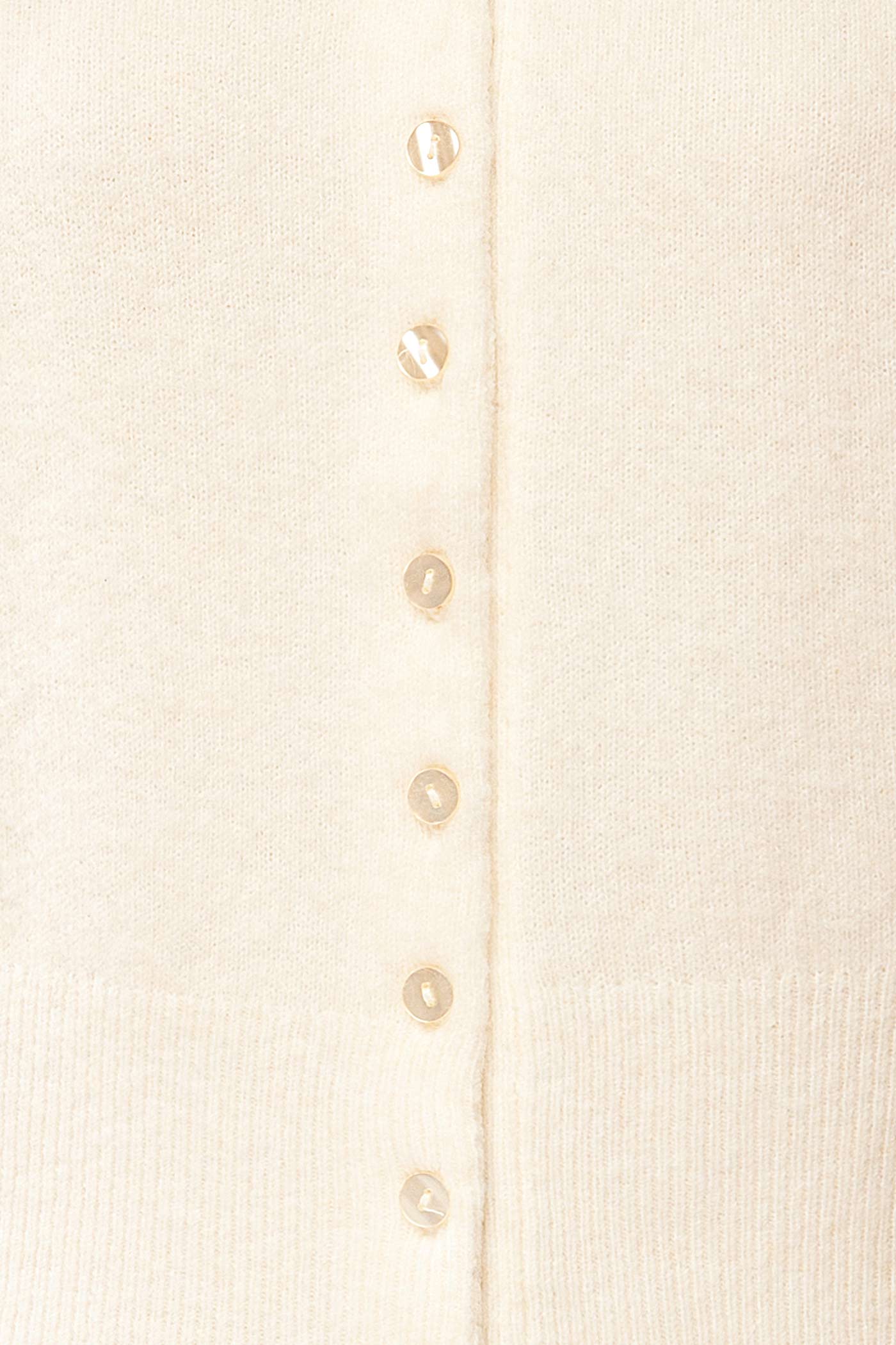 fabric view of Tierbo Ivory Cardigan with 3/4 Sleeves at La petite garçonne