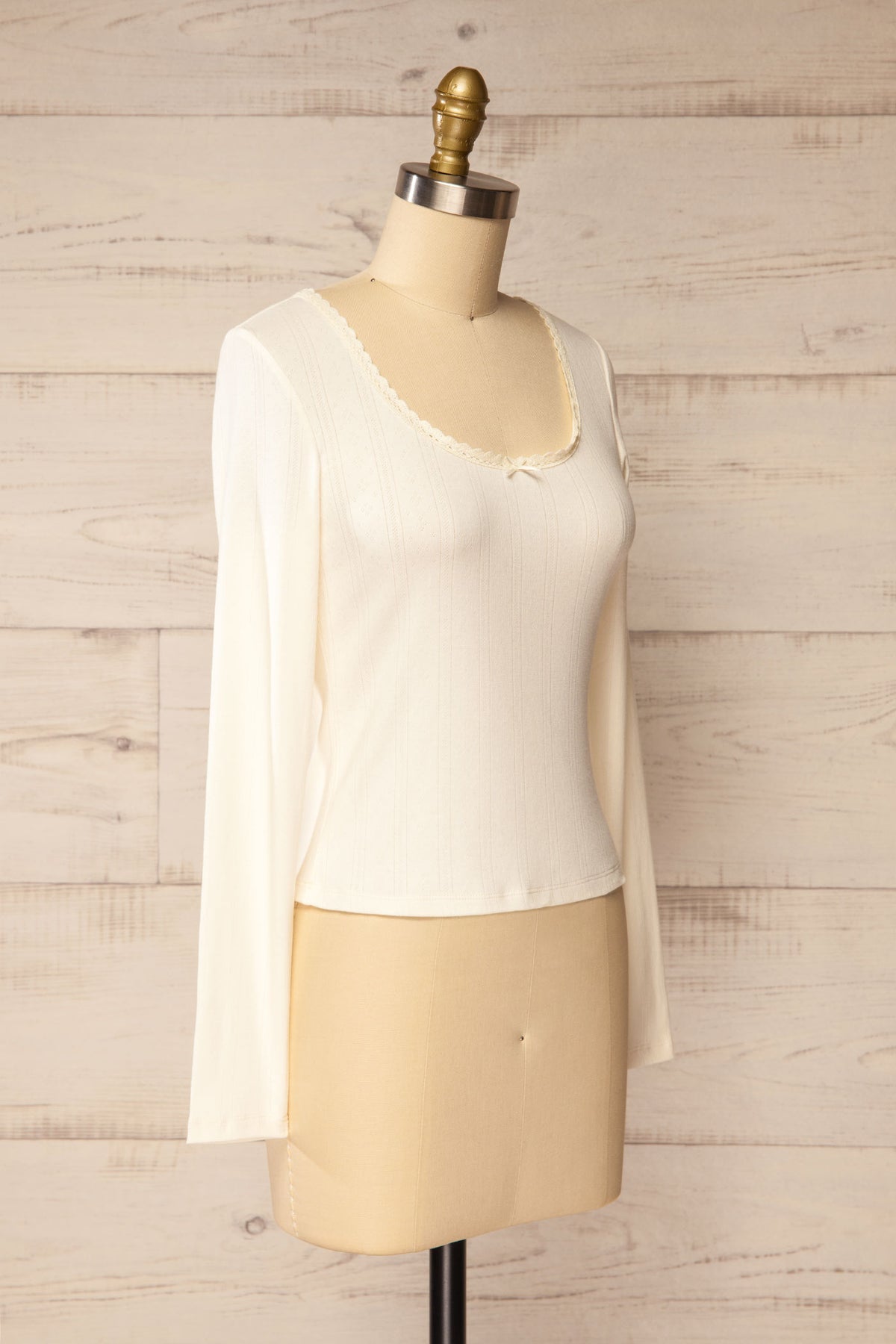 side view of Toulal Ivory Lace-Trim Pointelle Long-Sleeve Top at La petite garçonne