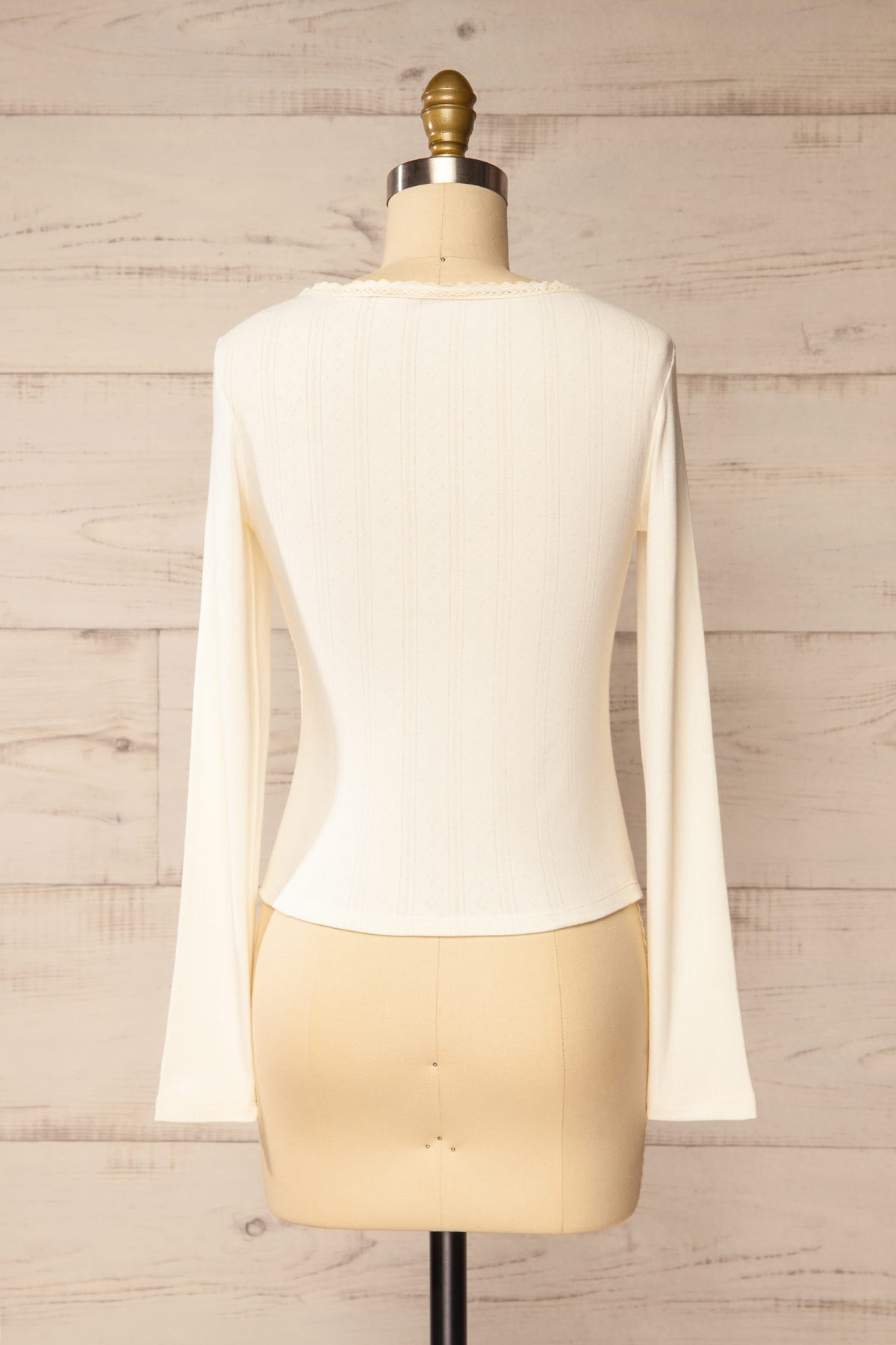 back view of Toulal Ivory Lace-Trim Pointelle Long-Sleeve Top at La petite garçonne