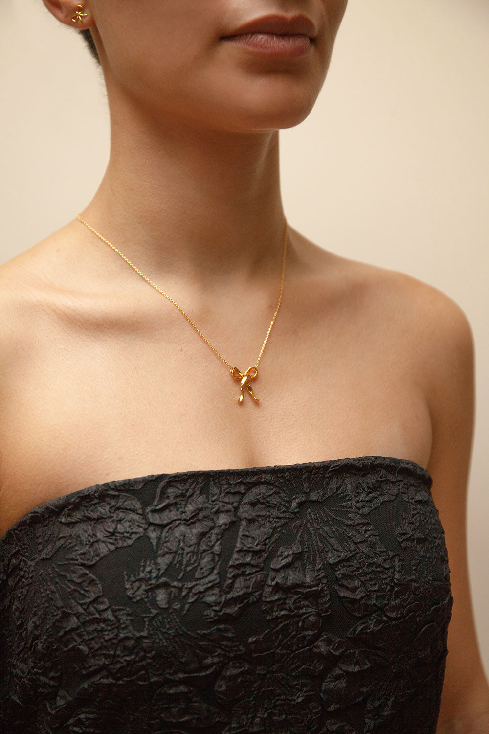 Triteia Gold Necklace w/ Bow Charm | Boutique 1861 model