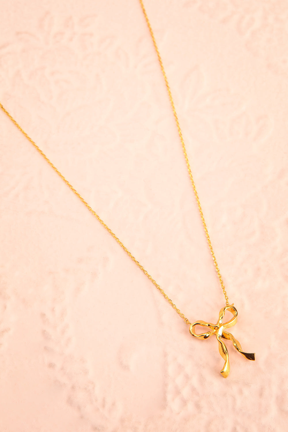 Triteia Gold Necklace w/ Bow Charm | Boutique 1861 flat view