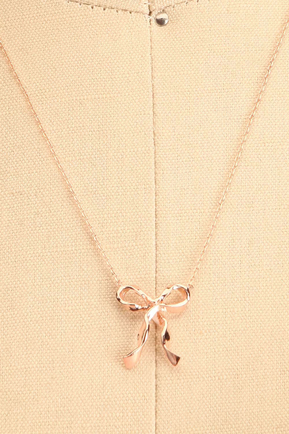 Triteia Rosegold Necklace w/ Bow Charm | Boutique 1861 close-up