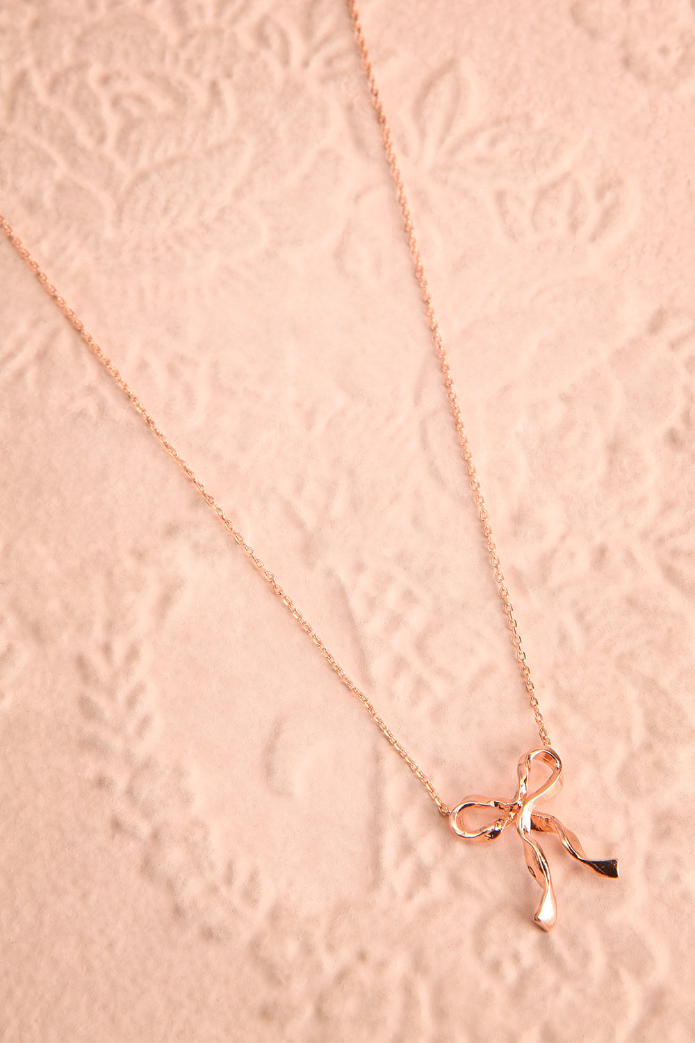 Triteia Rosegold Necklace w/ Bow Charm | Boutique 1861 flat view