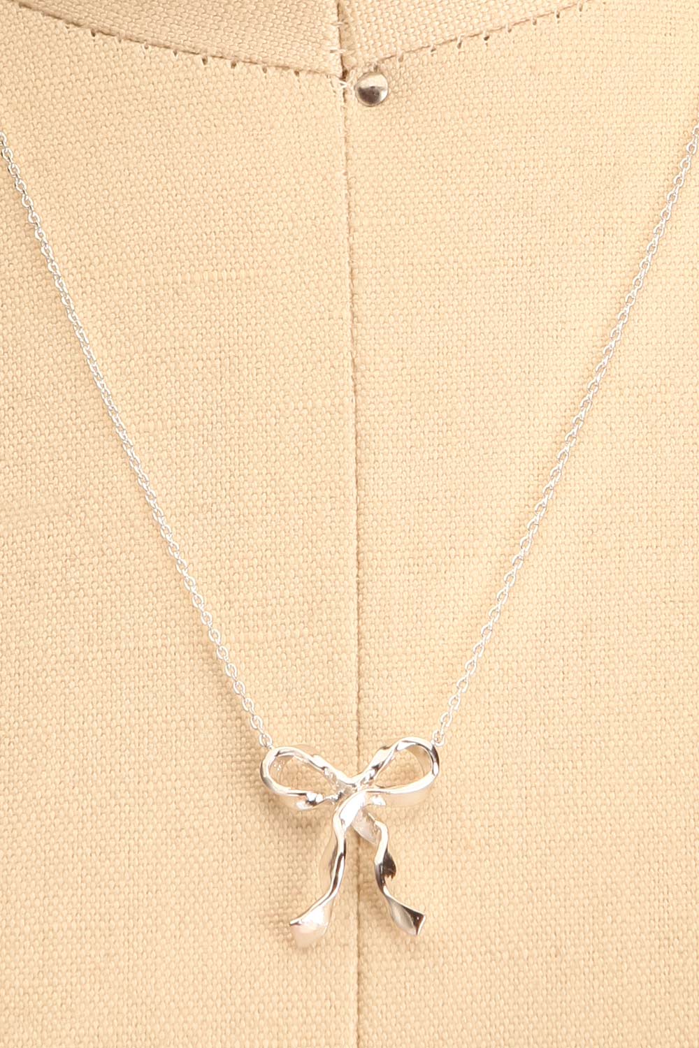 Triteia Silver Necklace w/ Bow Charm | Boutique 1861 close-up