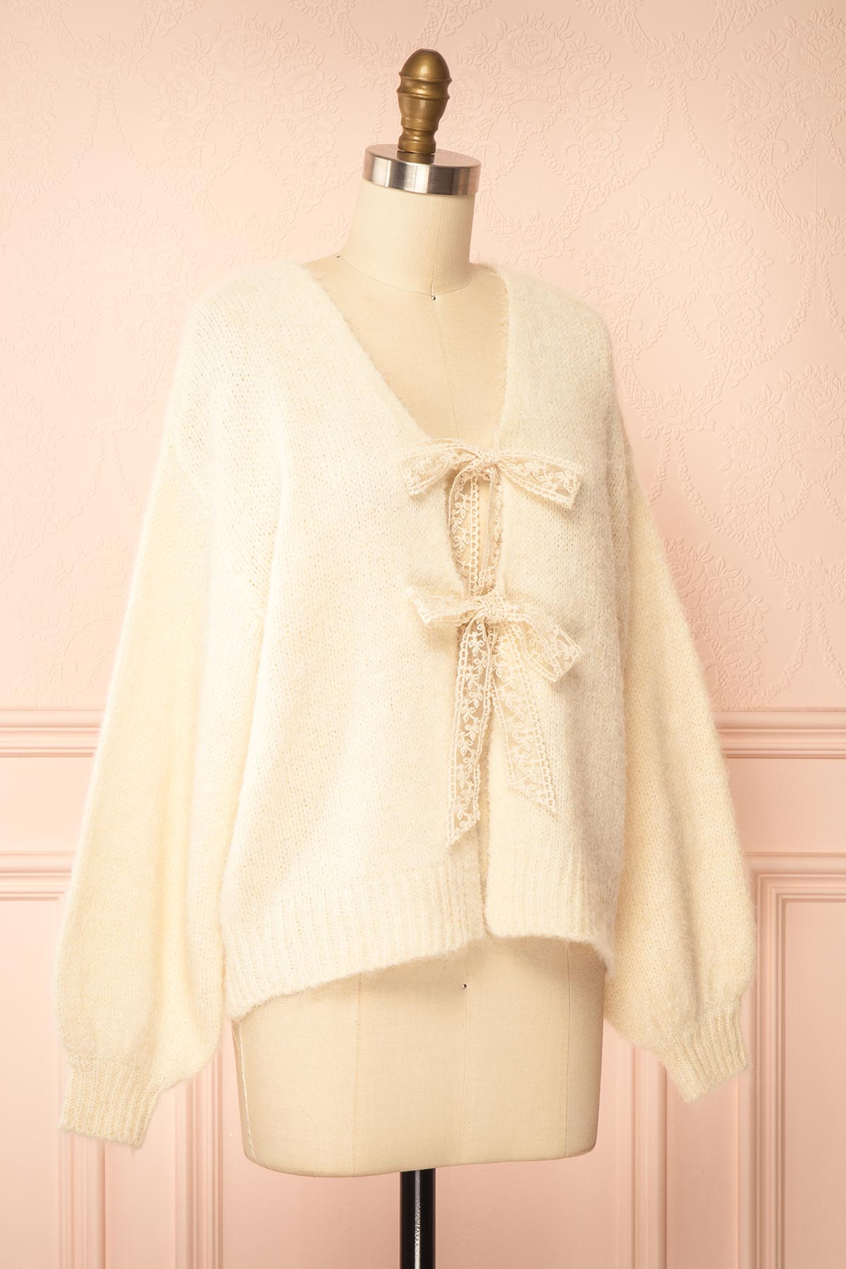 side view of Tsubaki Beige Knit V-Neck Cardigan Sweater with Lace Bows at Boutique 1861
