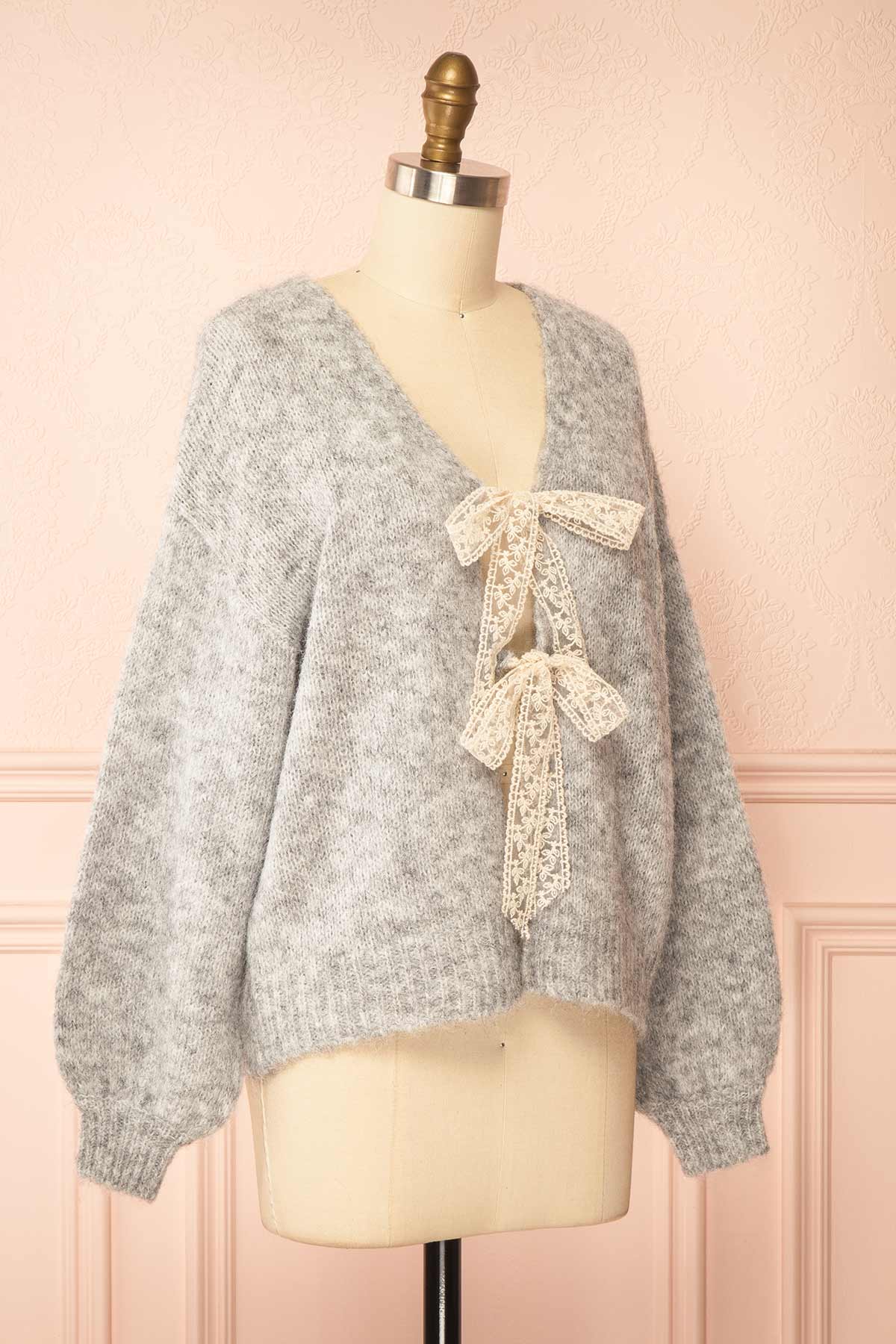 side view of Tsubaki Grey Knit V-Neck Cardigan Sweater with Lace Bows at Boutique 1861