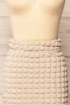 Wyrley Beige Popcorn Textured Midi Skirt | La petite garçonne front