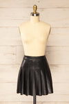 Xichang Black Faux Leather Short Pleated Skirt | La petite garçonne front view
