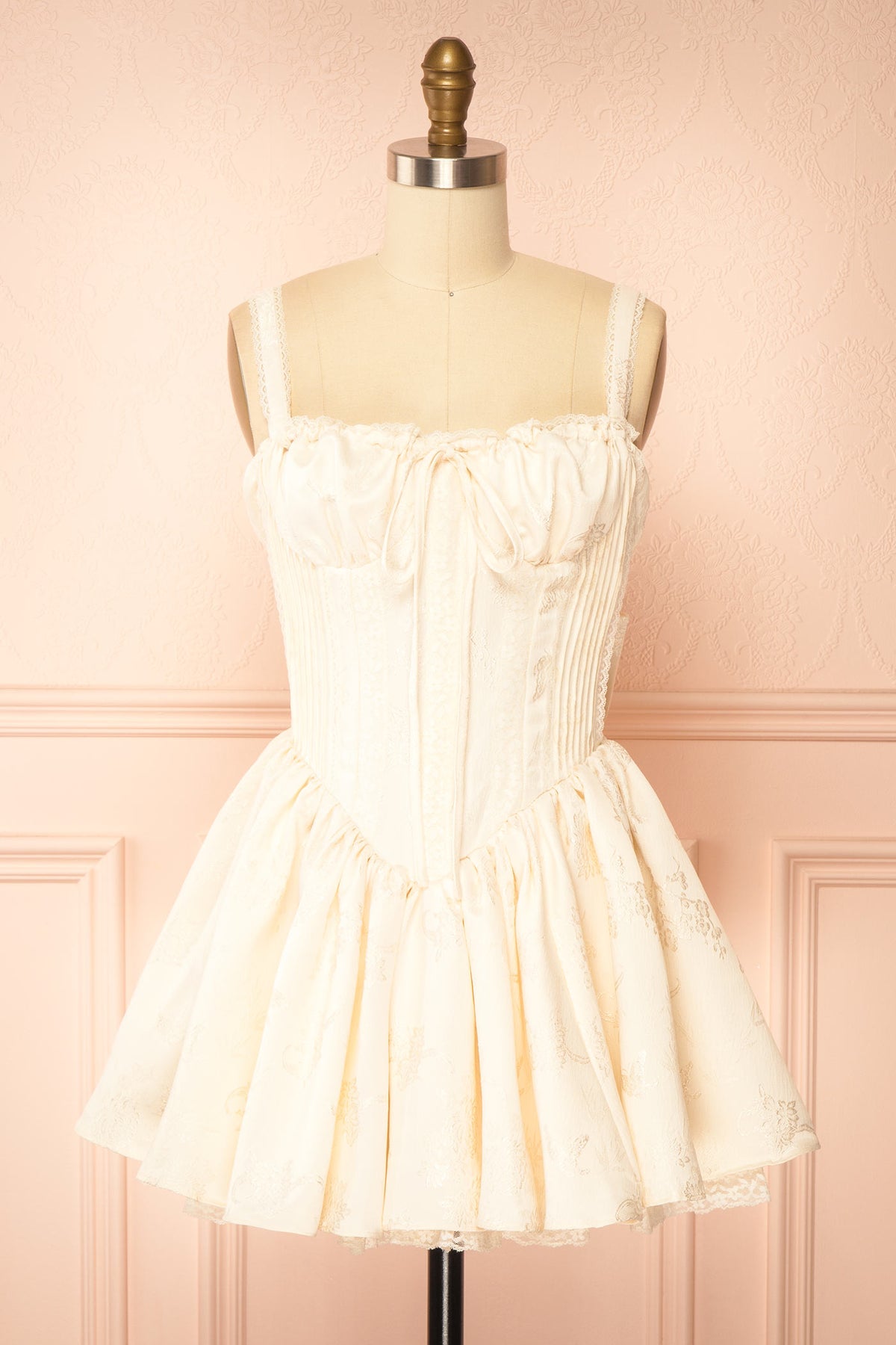 front view of Zolda Ivory Short Jacquard Corset Dress with Back Bow at Boutique 1861