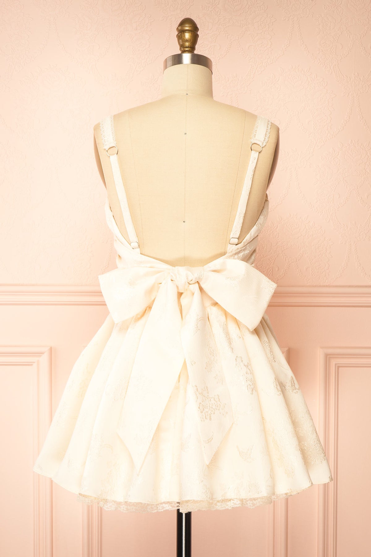back view of Zolda Ivory Short Jacquard Corset Dress with Back Bow at Boutique 1861