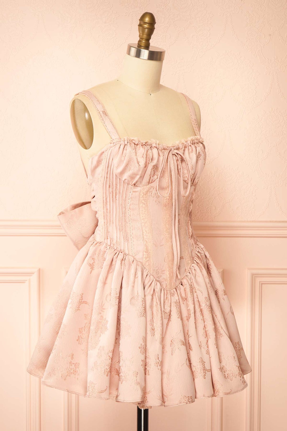side view of Zolda Pink Short Jacquard Corset Dress with Back Bow at Boutique 1861