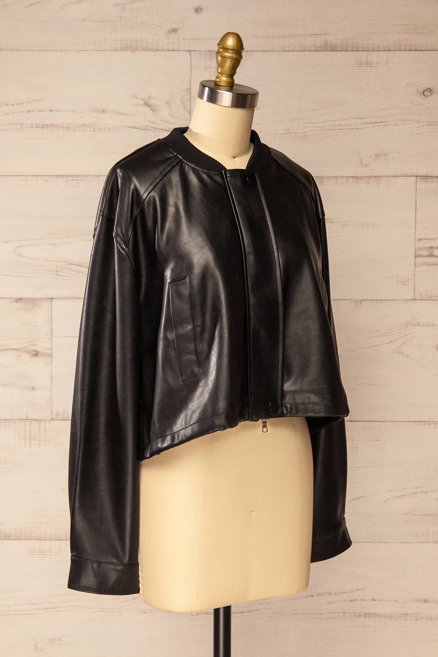 loose side view view of Zottegem Black Faux-Leather Cropped Jacket at La petite garçonne