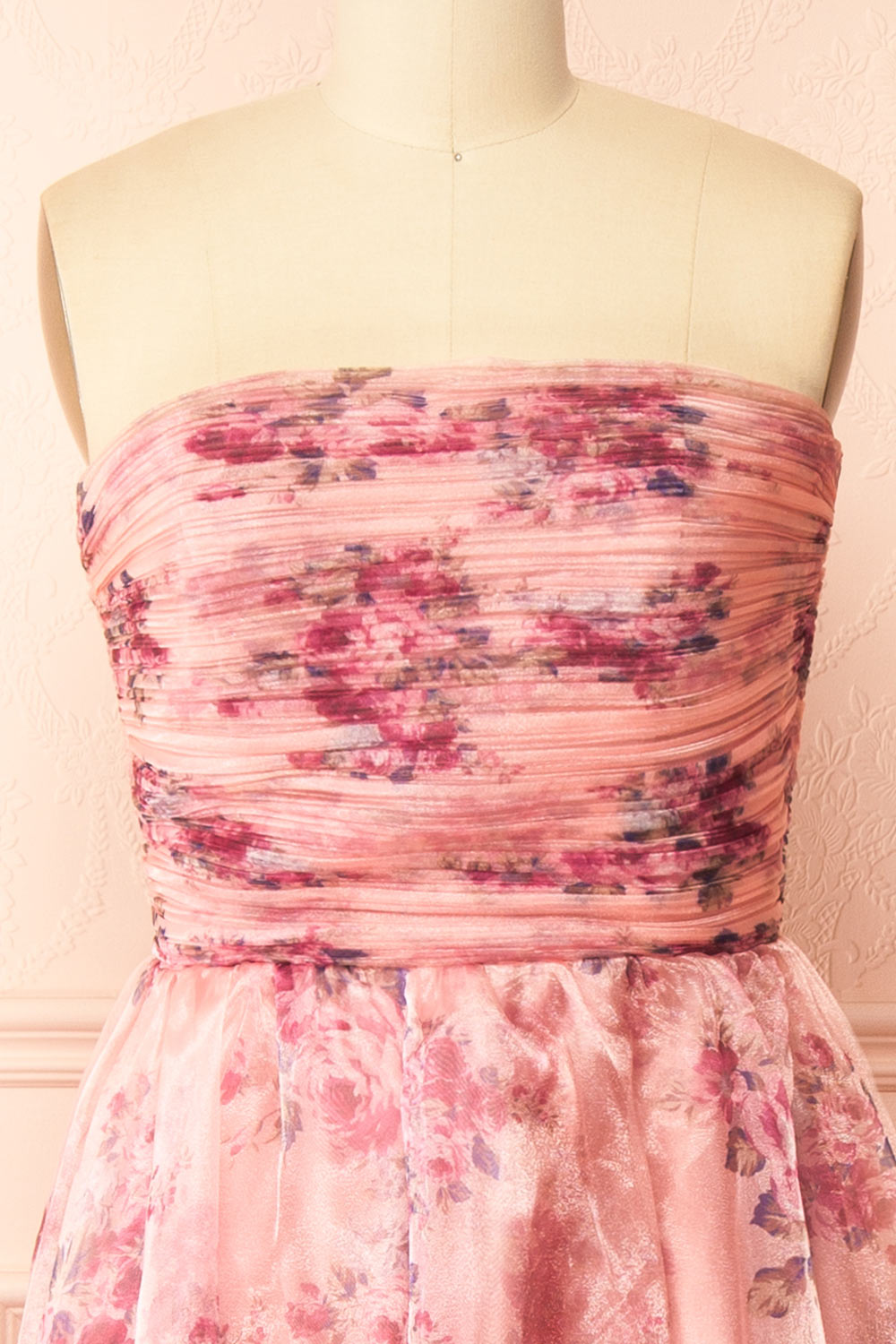 front of sewing mannequin wearing Zouleikha Pink Floral Maxi Strapless Dress from Boutique 1861