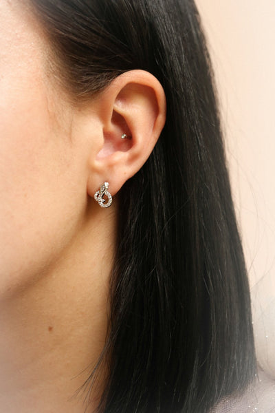 Acerra Or Golden Snake Stud Earrings | La Petite Garçonne on model