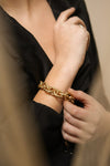 Aiptasia Oversized Golden Chain Bracelet | La Petite Garçonne on model