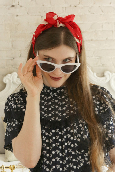 Alentejo Red & Cream Polka Dot Scarf | La Petite Garçonne on model wearing it as a headband