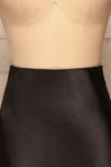 Alia Noir Black Midi Satin Skirt | Jupe front close up | La Petite Garçonne