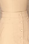 Alijo Beige Button-Up Mini Skirt with Pockets | La Petite Garçonne side close-up