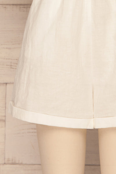Arahal White Short Sleeved Linen Romper | La petite garçonne bottom close-up