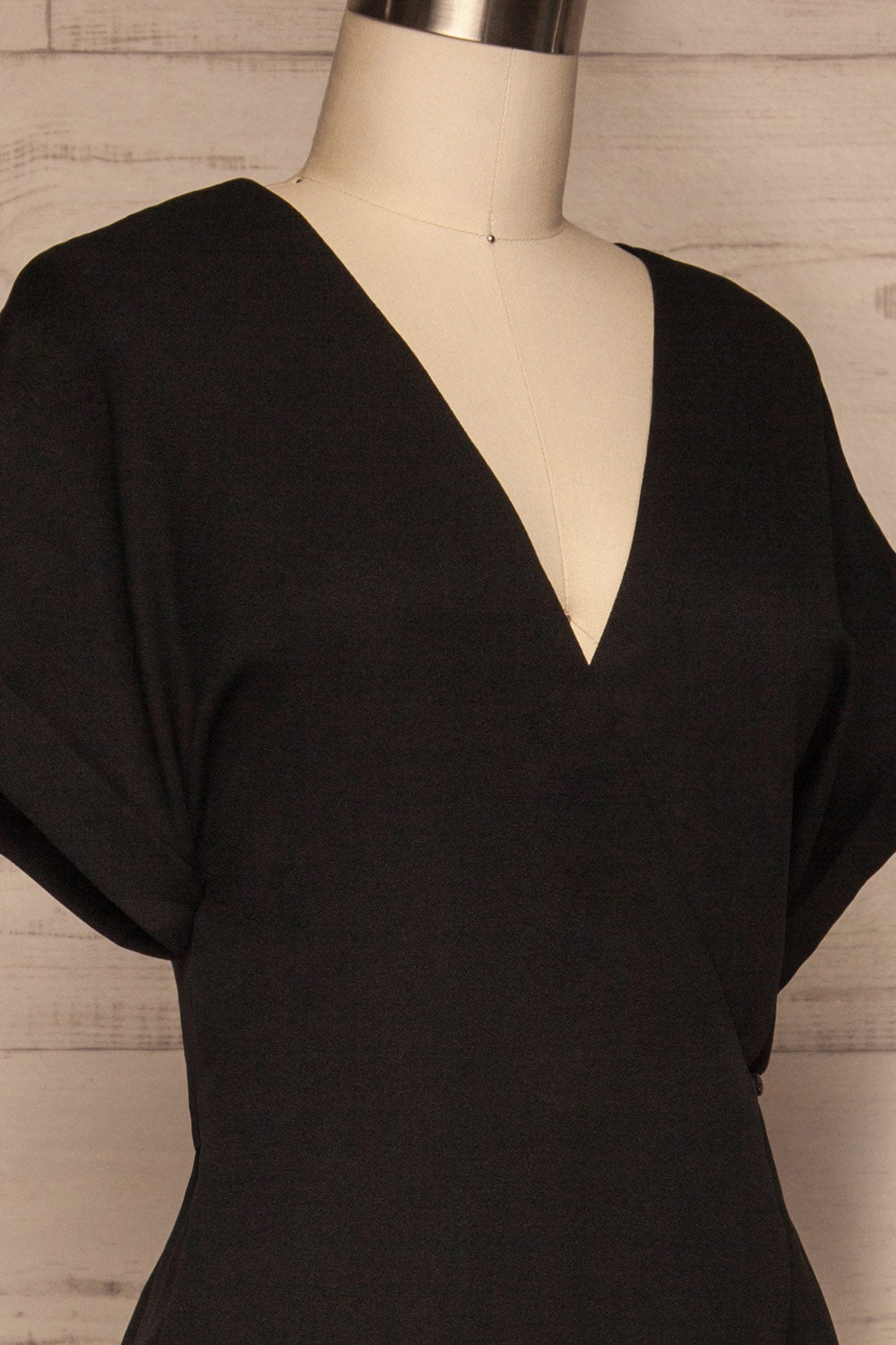 Brescia Black Short Sleeve Wrap Romper side close up | La petite garçonne