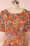 Cahan Cinnamon Orange Floral Silky Midi Dress face close up | Boutique 1861