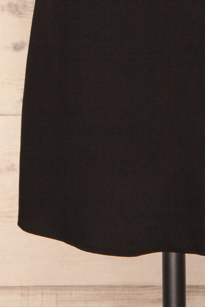 Calupina Black Cocktail Dress with Cowl Neck | La Petite Garçonne bottom close-up