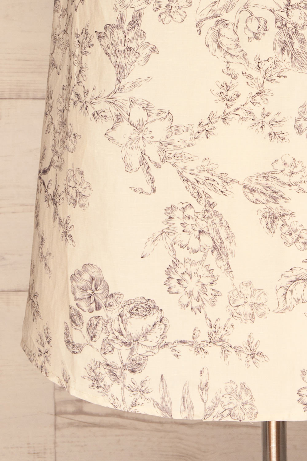 Cariyacu Off-White Floral Wrap Dress | La petite garçonne  bottom close-up