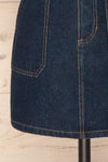 Cieszyn Dark Blue Denim Mini Skirt with Pockets | La Petite Garçonne bottom close-up