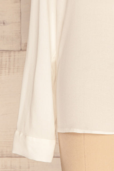 Clonmel Blanc White V-Neck Shirt sleeve close up | La Petite Garçonne