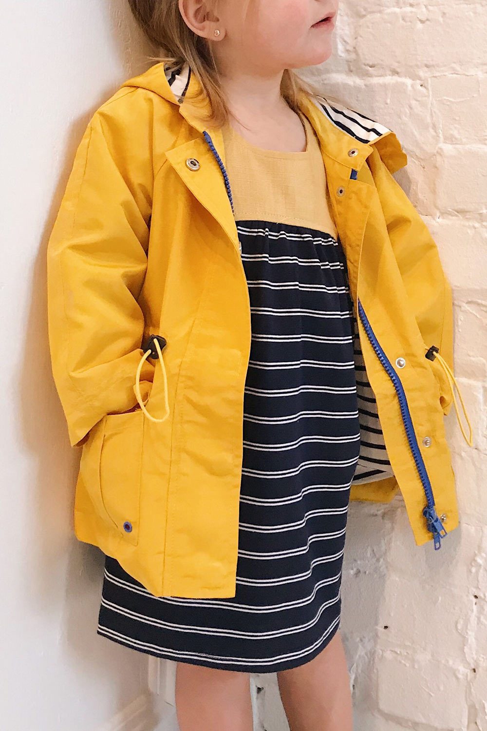 Noville Mini Yellow Kids Hooded Rain Jacket | La Petite Garçonne model close up