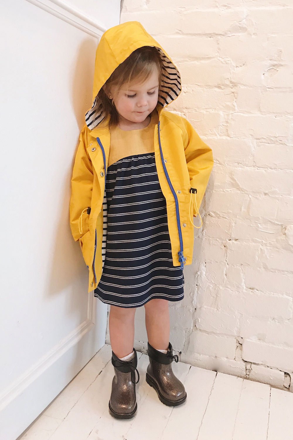 Noville Mini Yellow Kids Hooded Rain Jacket | La Petite Garçonne on model