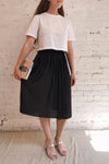Gouves Black Pleated Midi Skirt | La petite garçonne on model