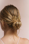 Cybela Gold Hair Combs Set with Leaves | Boudoir 1861 on blond model with a low bun